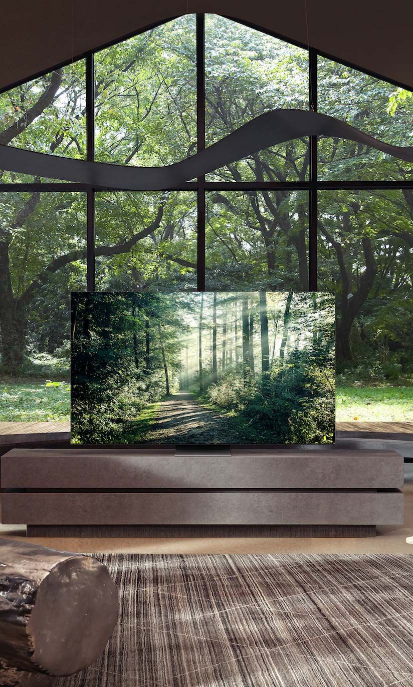 samsung tv in a room with large glass walls
